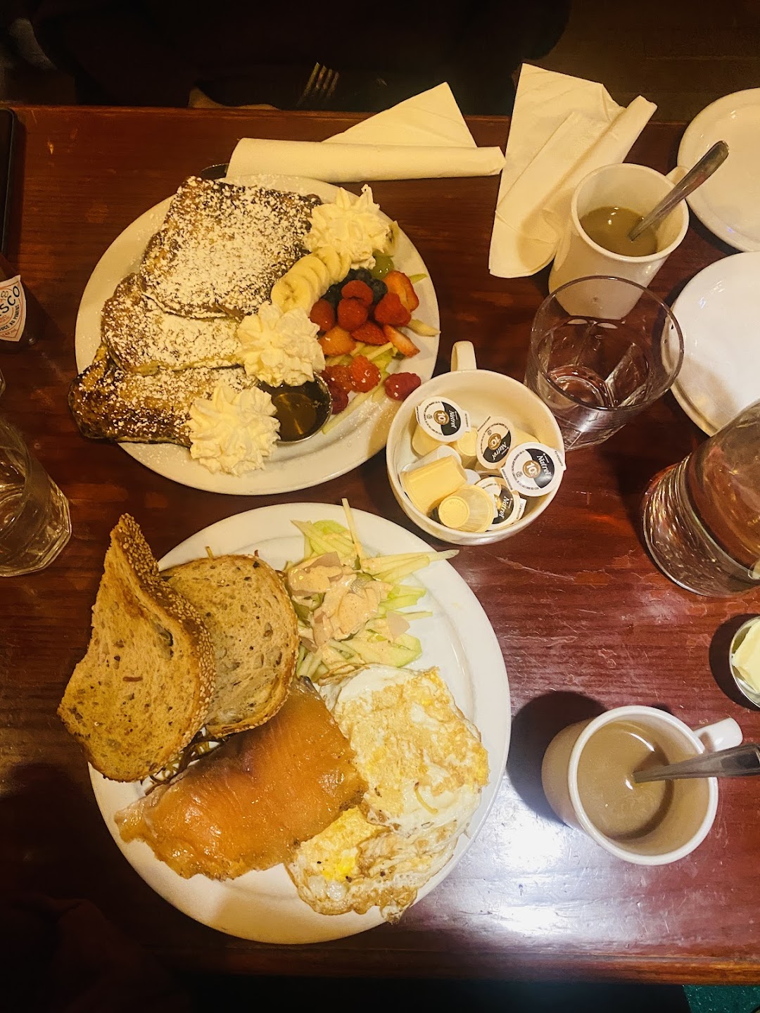 Brunch spread with French toast, eggs, and fresh coffee